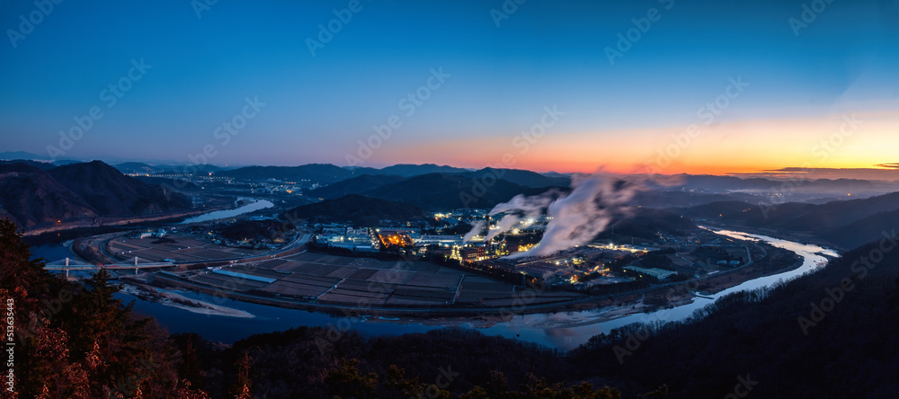 Scenic views of mountains and river against sky during sunrise