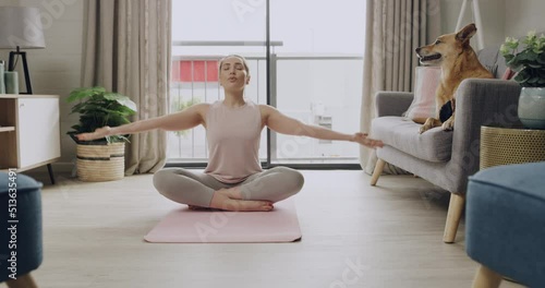 Young caucasian woman meditating while practicing yoga at home. One female athlete working out and exercising inside. Focus, relax, find your center and better the health of your body and mind photo