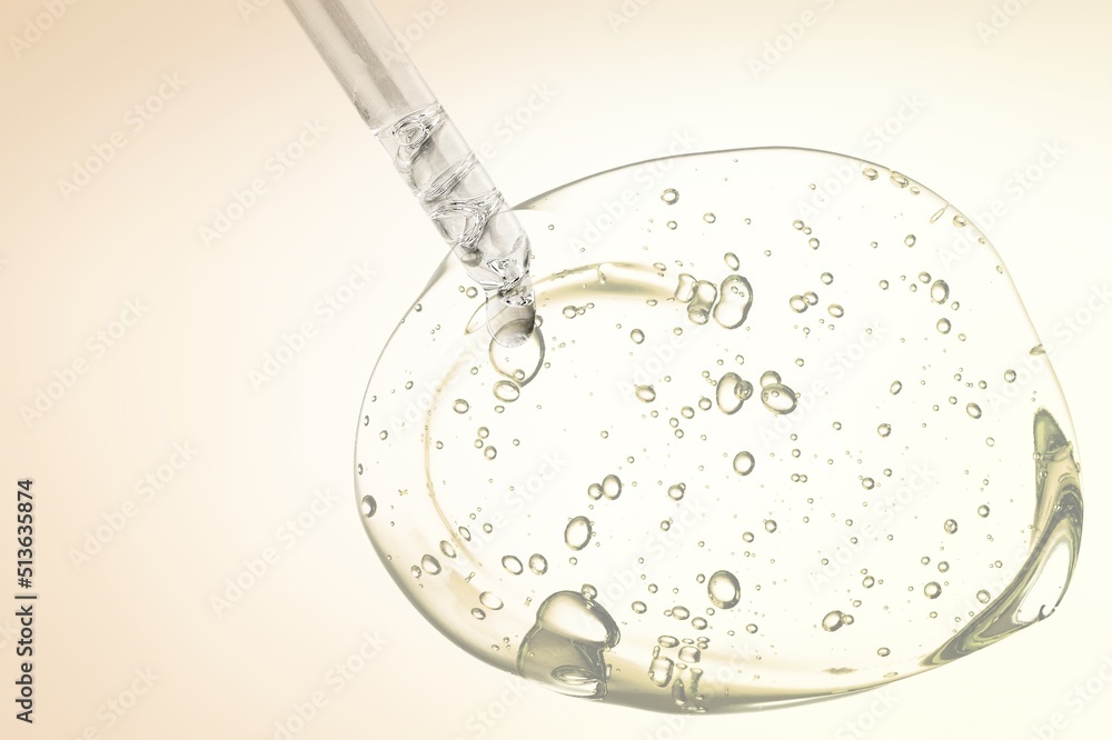 Vitamin C serum liquid texture with dropper on the desk Vitamin C serum liquid texture with dropper on the desk
