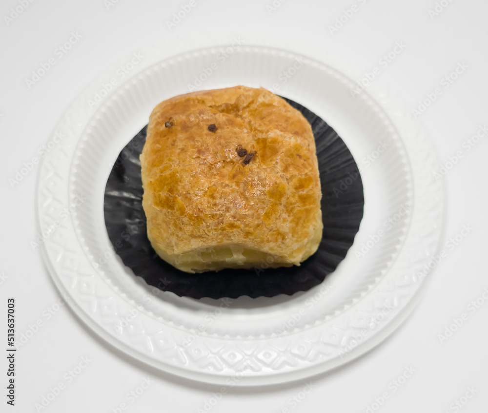 The market snack is banana cake in a white container