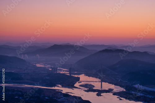 Scenic view of mountains against sky during sunrise © Sangoh