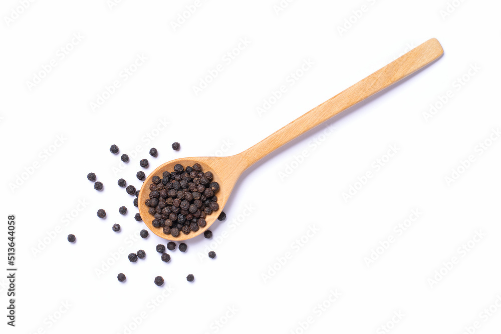Black peppercorn (black pepper) in wooden spoon isolated on white background, top view, flat lay. Black peppercorn (black pepper) in wooden spoon isolated on white background, top view, flat lay.