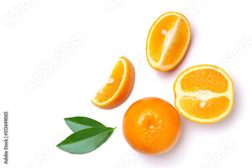 Orange fruit with cut sliced and green leaves isolated on white background, top view, flat lay.