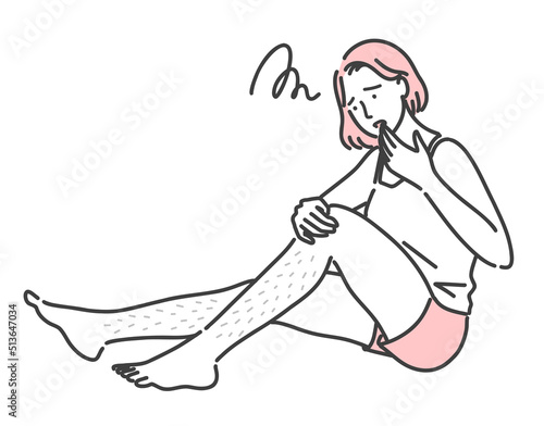 足のムダ毛に悩んでいる若い女性
