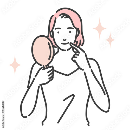 鏡を見て笑顔の若い女性

