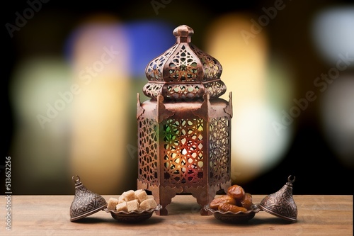 Fawanis. Traditional Ramadan lantern with prayer beads on background. photo