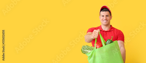 Deliveryman holding eco bag...