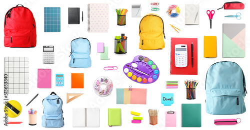 Set of school backpacks and stationery on white background photo