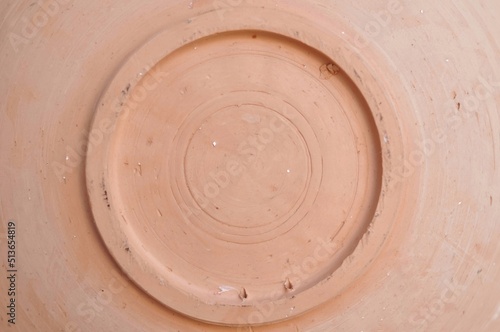 Close up of round earthenware bottom copy space photo
