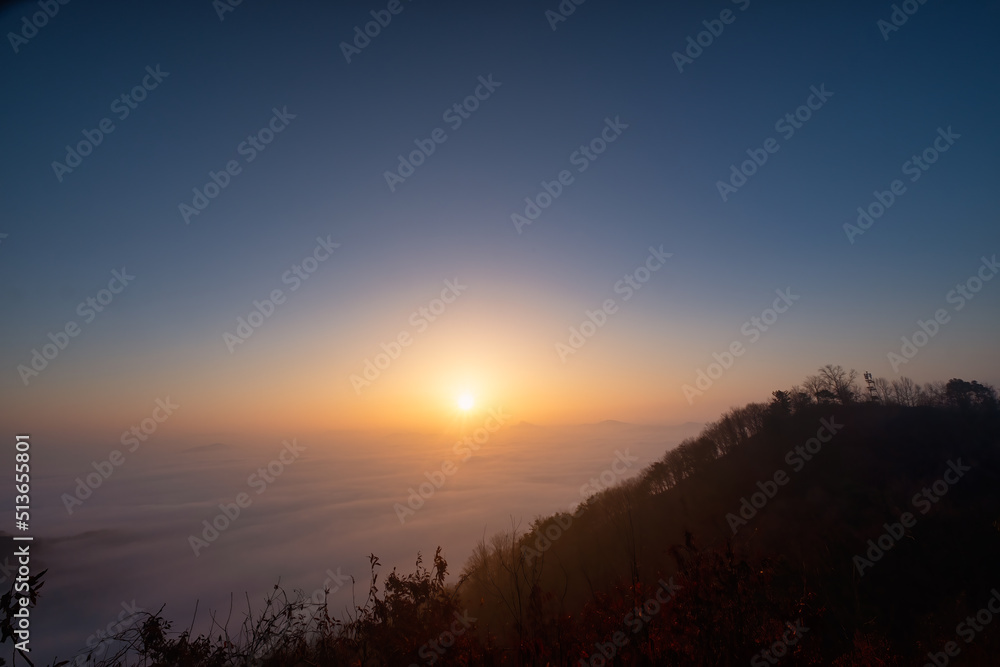 Scenic view of mountains against sky during sunrise Scenic view of mountains against sky during sunrise
