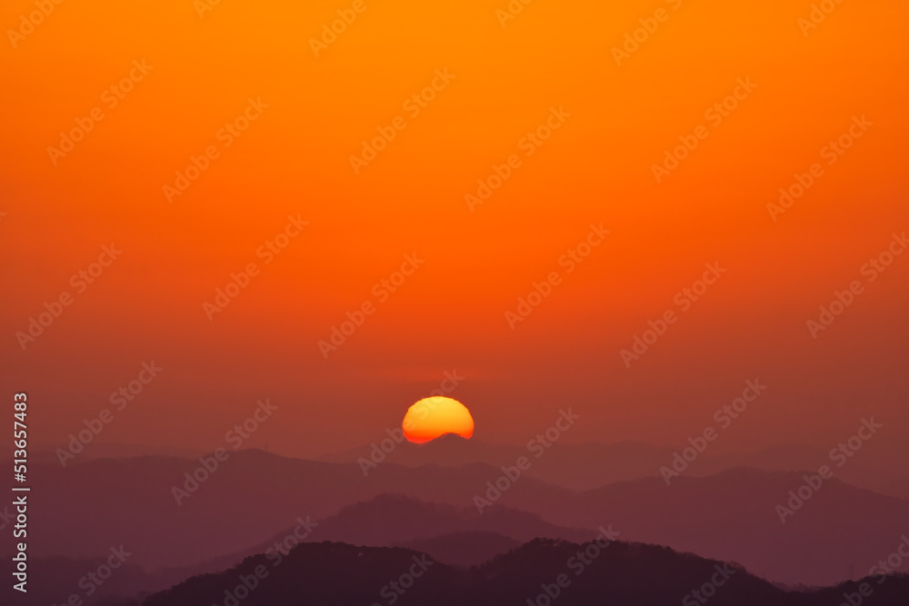 Scenic view of mountains against sky during sunrise