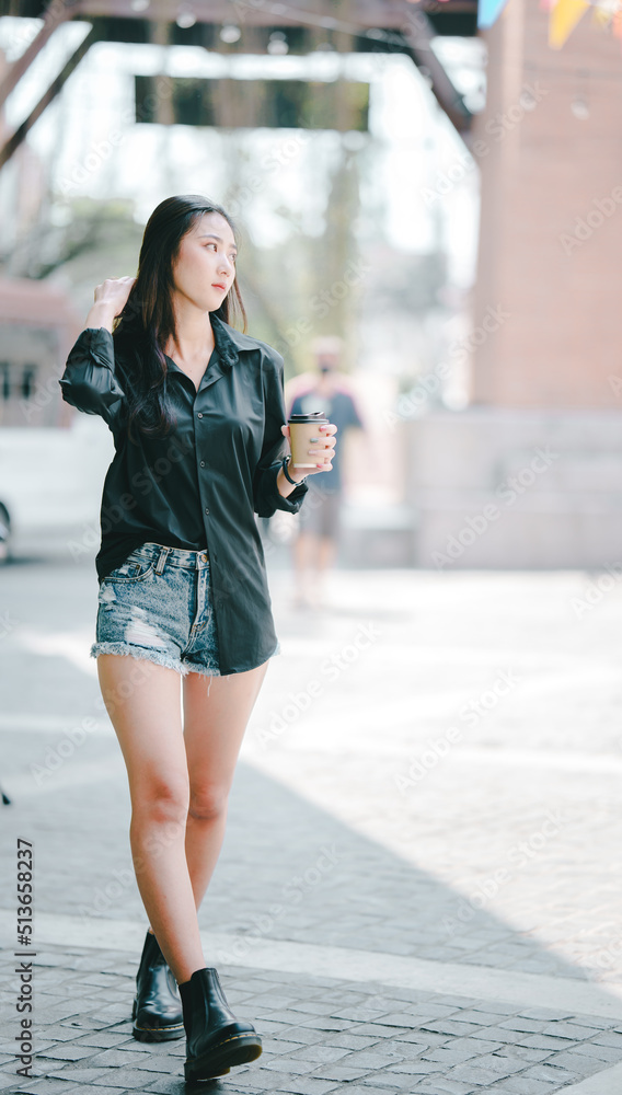 Portrait of a beautiful Asian girl outdoors. Portrait of a beautiful Asian girl outdoors.