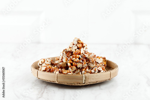 Brondong Jagung or Bororndong, Javanese Traditional Snack Sweet Popcorn with Sticky Palm Sugar. photo