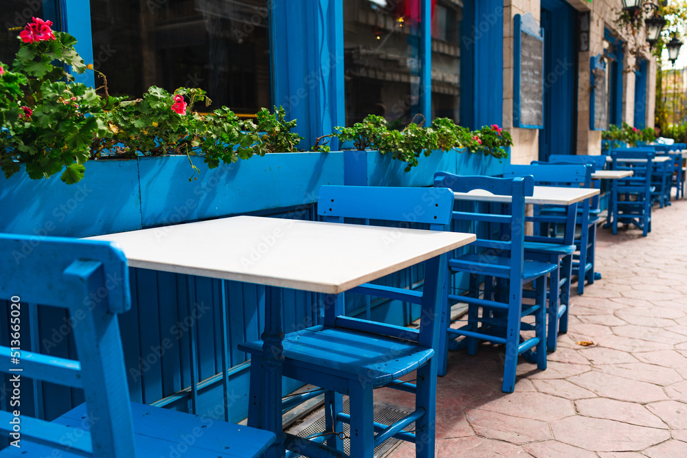 Street cafe in blue tones, empty tables in Istanbul