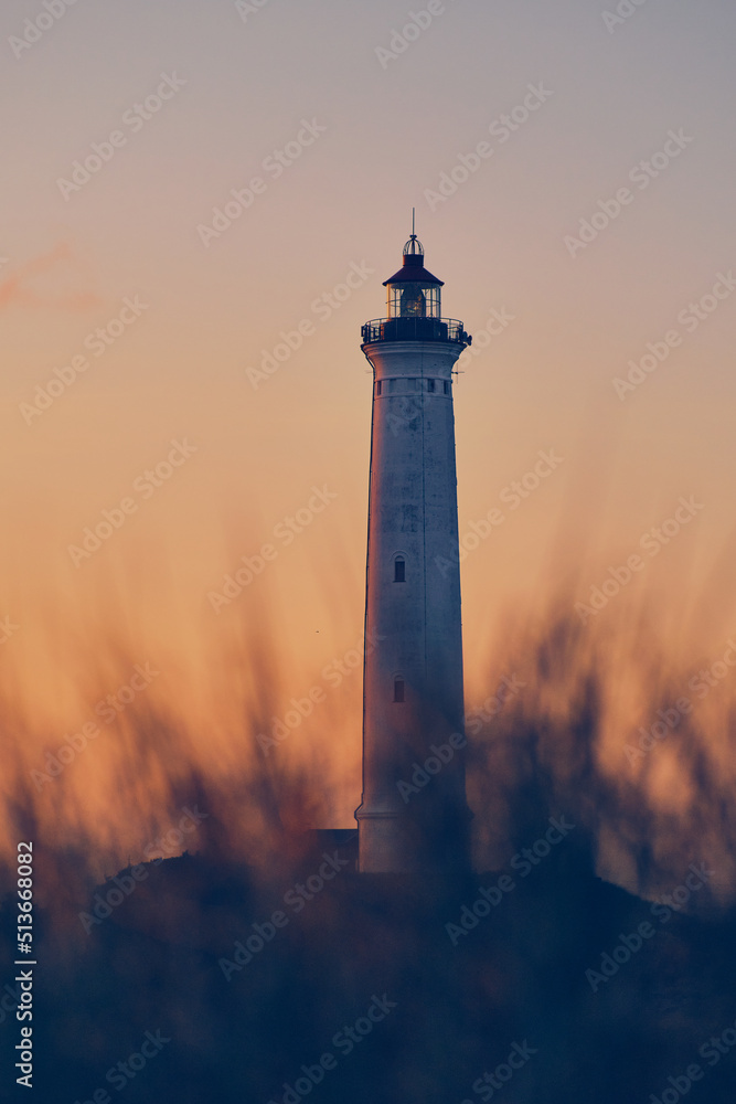 Lighthouse in the dunes at the danish coast. High quality photo