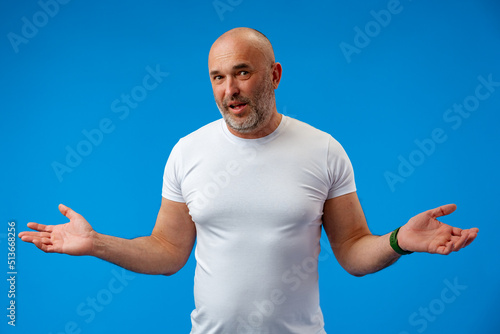 Man over isolated blue background with surprise facial expression.