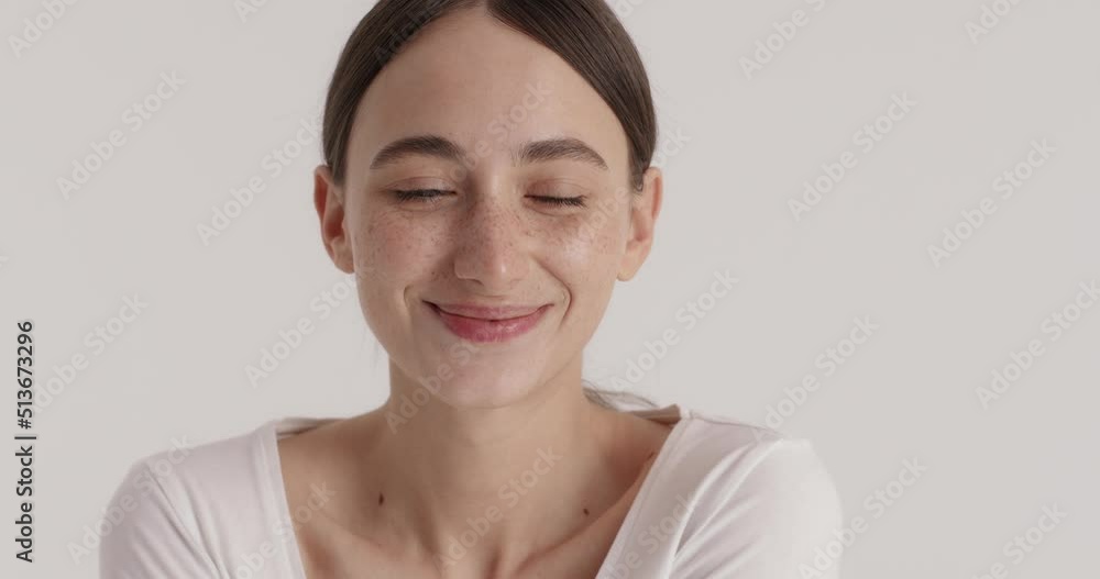 Pretty lady smiling after lifting hydrating moisturising routine