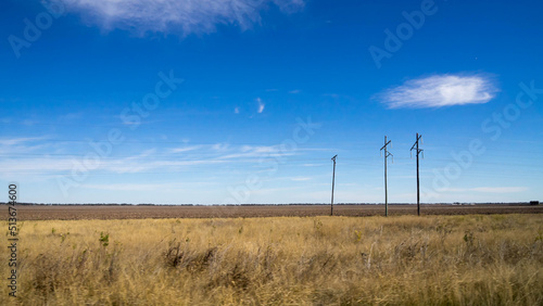 Minimal landscape with three telegraph poles photo