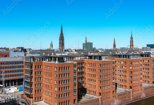 Ausblick von der Elbphilharmonie auf das Columbiahaus, dem Michel, den Sandtorhafen und die Hafencity photo