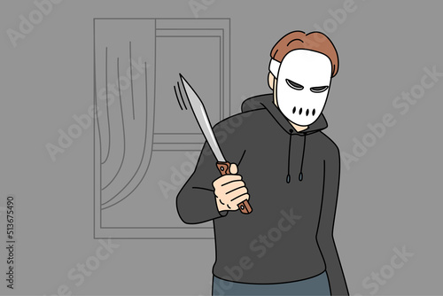Thief in mask with knife at robbery