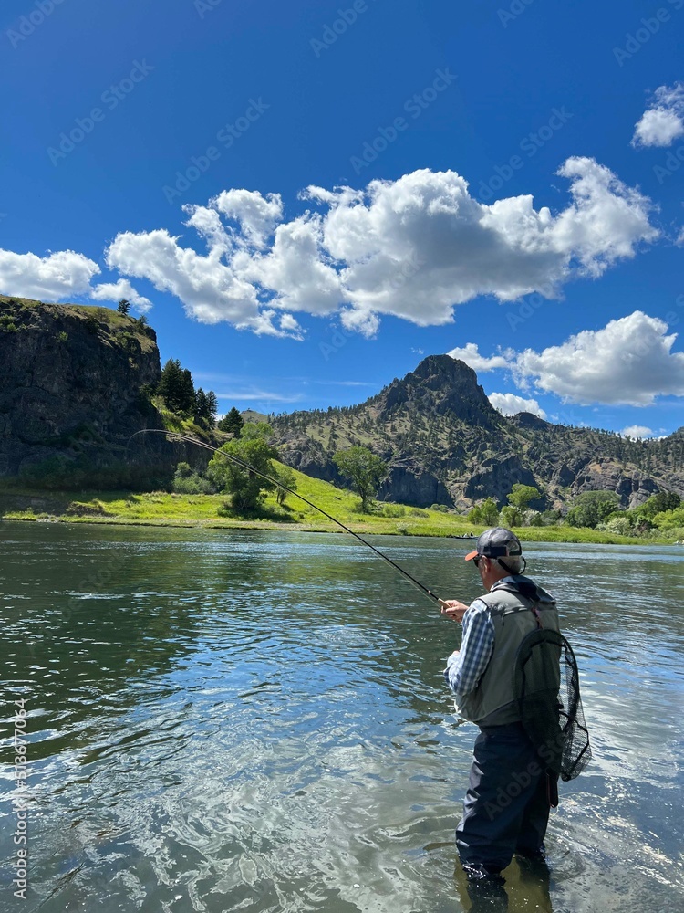 catch of a beautiful rainbow trout by a fly fisherman in Montana catch of a beautiful rainbow trout by a fly fisherman in Montana
