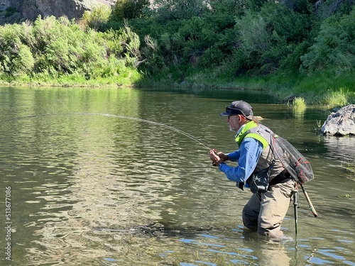 catch of a beautiful rainbow trout by a fly fisherman in Montana