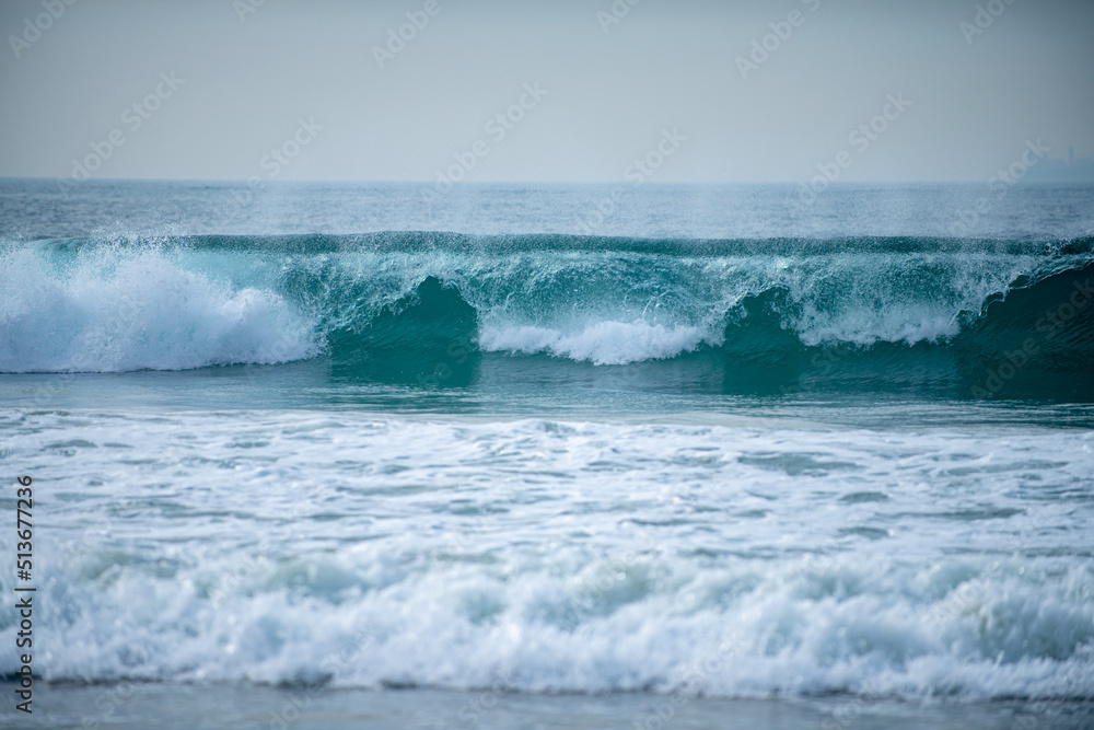 Panorama of tropical ocean water, sea waves. Calm water, ocean background. Panoramic sea landscape. Sea foam.
