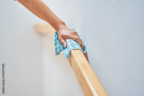 Picture of woman cleaning stair steps or railing