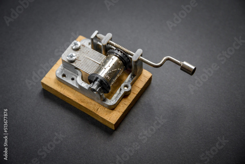 Traditional music box isolated on black photo