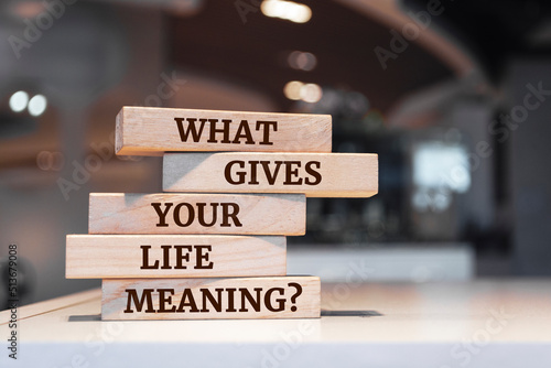 Wooden blocks with words 'What gives your life meaning question'.