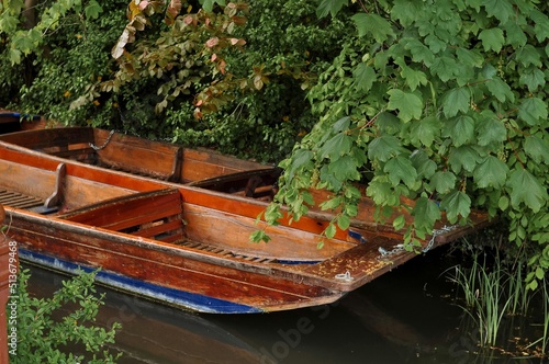 wooden boats for several tourists for river walks on water . 