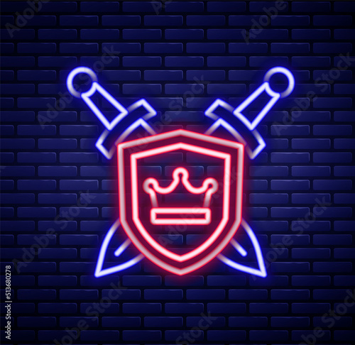 Glowing neon line Medieval shield with crossed swords icon isolated on brick wall background. Colorful outline concept. Vector
