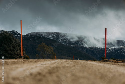 storm over the mountains with Snow, Dirt road