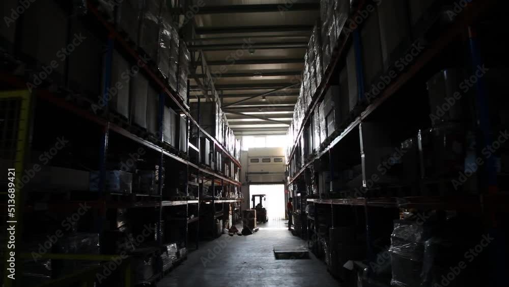 Industrial warehouse. Warehouse of a trade organization. Goods and materials arranged on a rack in warehouse. Warehouse store stock. Industrial warehouse. Warehouse of a trade organization. Goods and materials arranged on a rack in warehouse. Warehouse store stock.