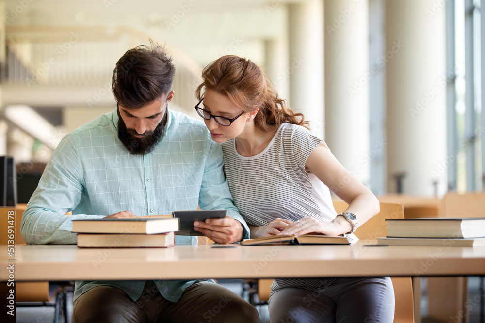 Education friendship people concept. Group of happy students learning together in college library Education friendship people concept. Group of happy students learning together in college library