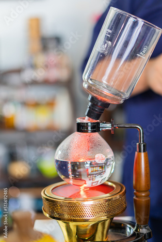 Making coffee with syphon method