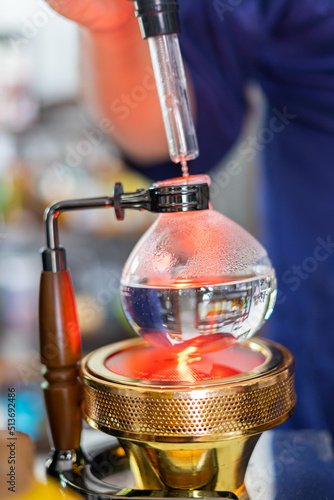 Making coffee with syphon method