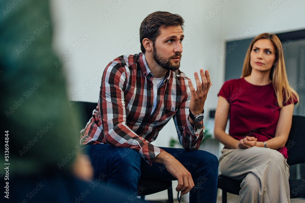 Focus on the bearded man talking about himself and his mental problems during group therapy. Focus on the bearded man talking about himself and his mental problems during group therapy.