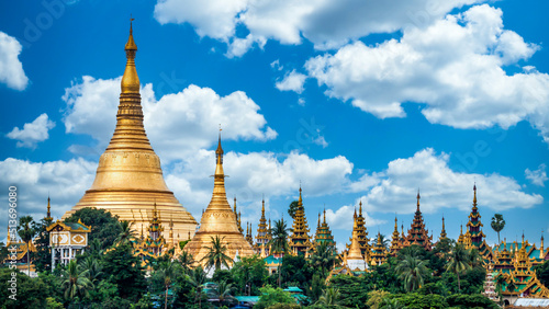 Shwedagon pagoda famous place popular and tourist attraction destination landmark in Yangon City, Shwedagon Pagoda Golden Pagoda with blue sky background, Yangon, Myanmar. photo