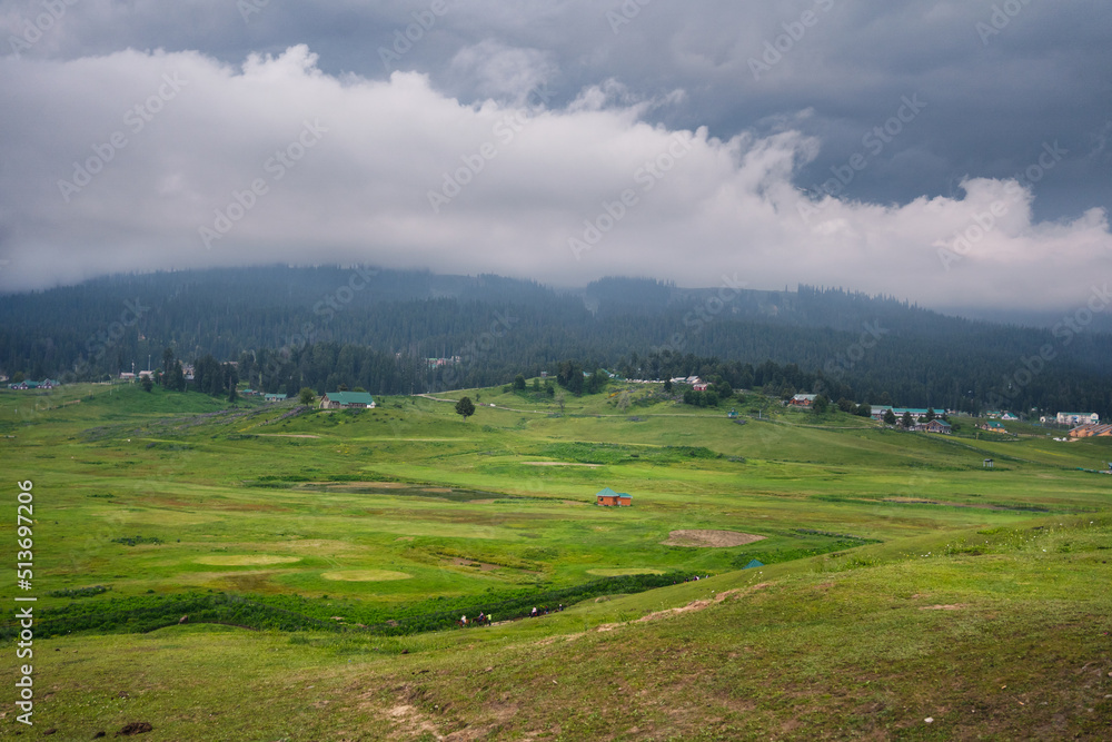 Gulmarg, known as Gulmarag in Kashmiri, is a town, hill station, popular skiing destination, and notified area committee in the Baramulla district of Jammu and Kashmir, India.