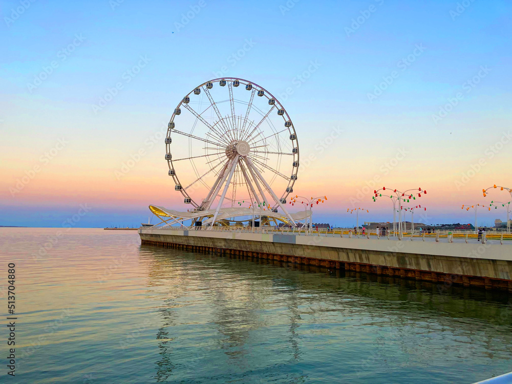 Ferris wheels in the coast of the city with beautiful weather in the evening.ferris wheel on a day.