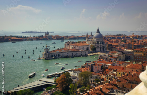 Aerial view of Basilica of Santa Maria della Salute against dramatic sky during day time, located at Punta della Dogana between the Grand Canal and the Giudecca Canal, in Venice, Italy