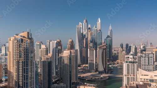 Fototapeta Naklejka Na Ścianę i Meble -  View of various skyscrapers in tallest recidential block in Dubai Marina aerial timelapse