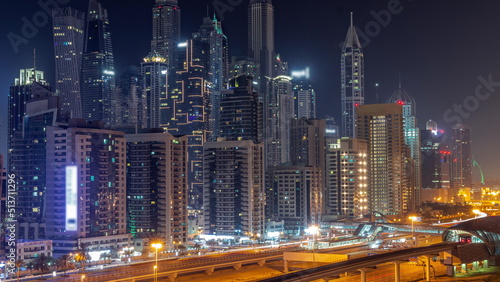 Dubai marina tallest block of skyscrapers all night timelapse. © neiezhmakov