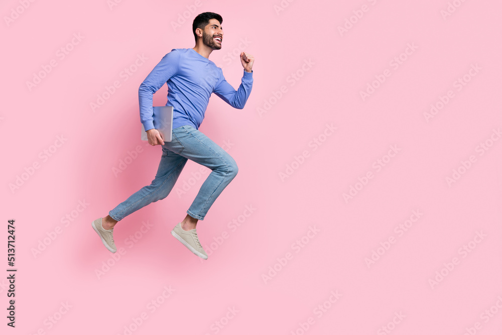 Full length photo of sweet funny arabian man wear long sleeve shirt holding gadget jumping running isolated pink color background