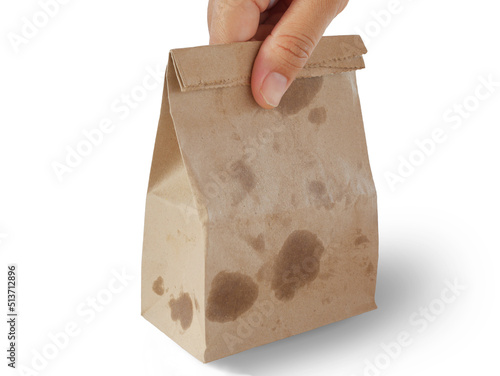 Paper bag of fried chickens and frenchfried on my hand 