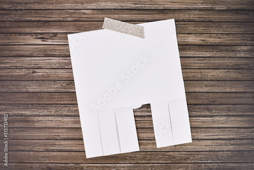 Billede på lærred White empty tear-off stub paper note without text on wooden wall
