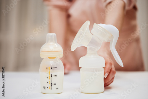 Stampa su tela Breast pump and bottle with milk for baby