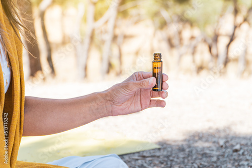 woman testing aromatherpy oils on a summertime mindfulness ritual.