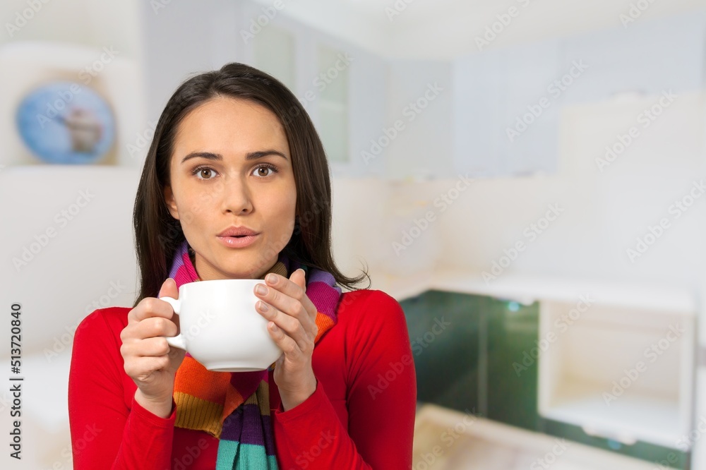 Young woman enjoying aromatic coffee near modern machine in kitchen Young woman enjoying aromatic coffee near modern machine in kitchen